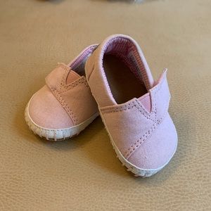 Tiny pink Toms shoes size 2